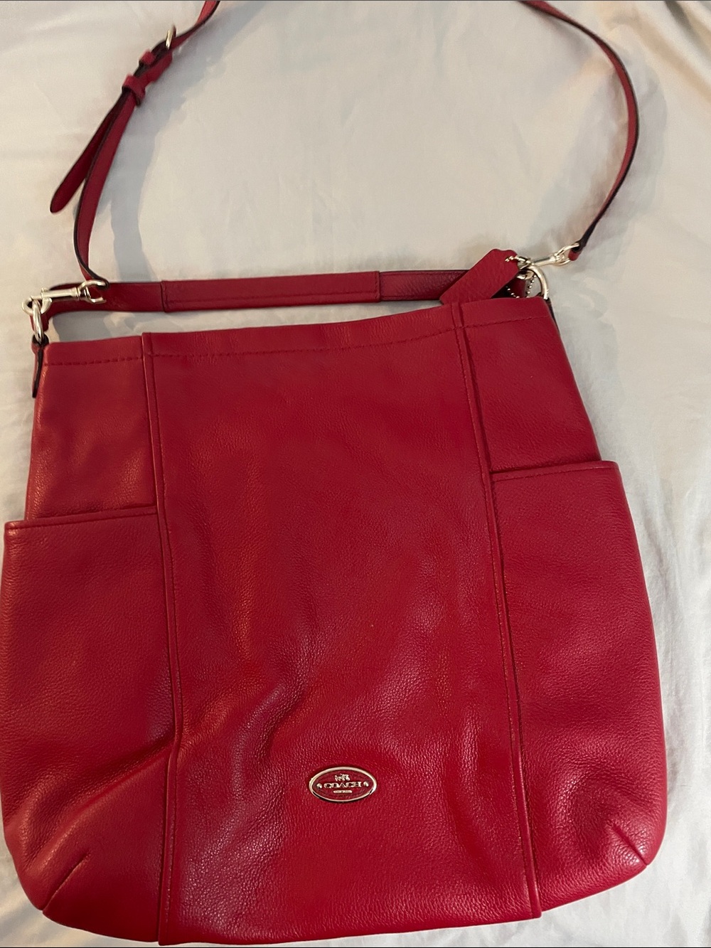 Coach Red Leather Crossbody Bag with hand held strap. Beautiful pebble leather.